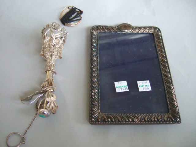 Appraisal: A silver mounted shaped rectangular photograph frame with a decorated