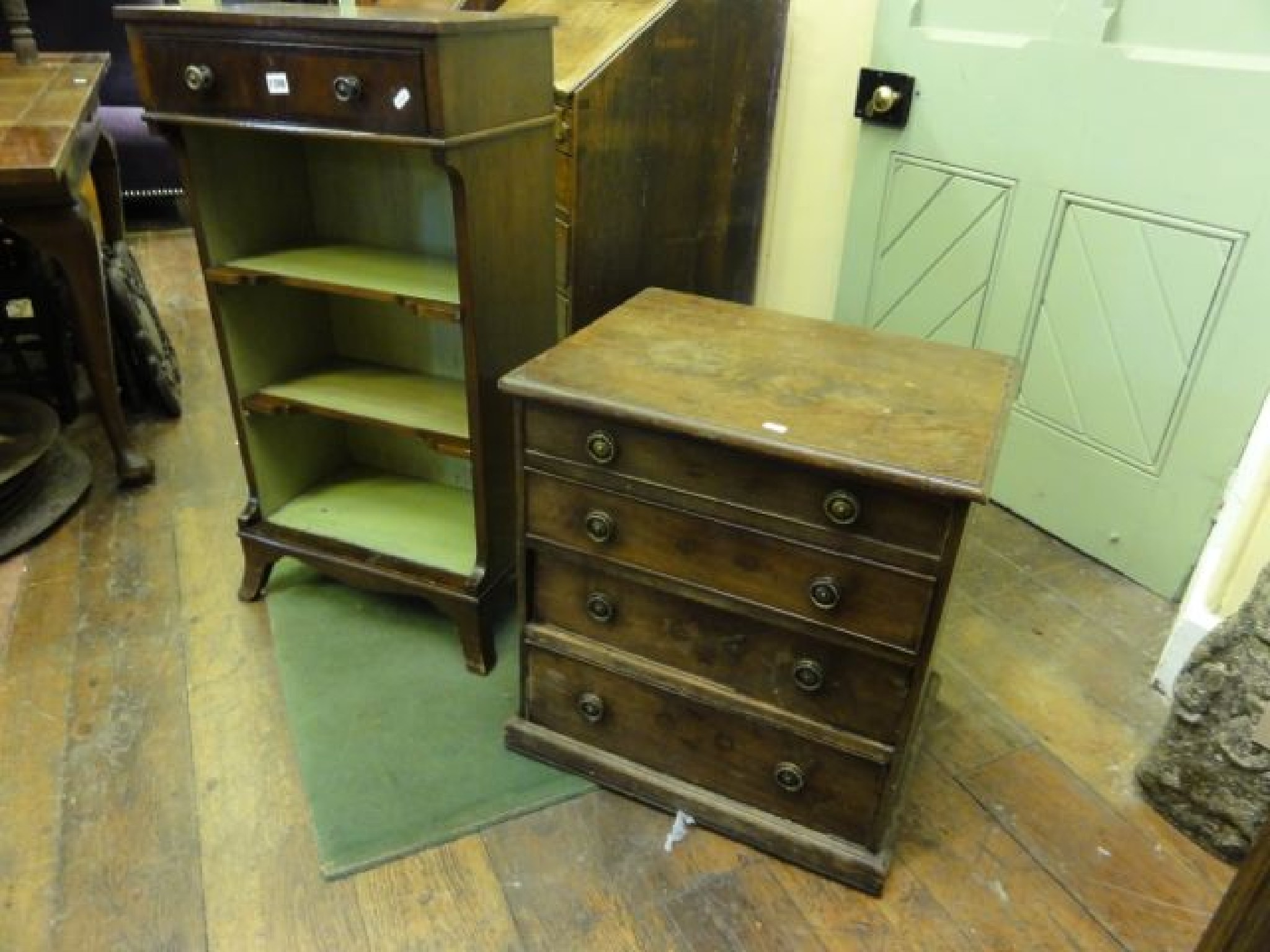 Appraisal: A small mahogany tower of four long drawers together with