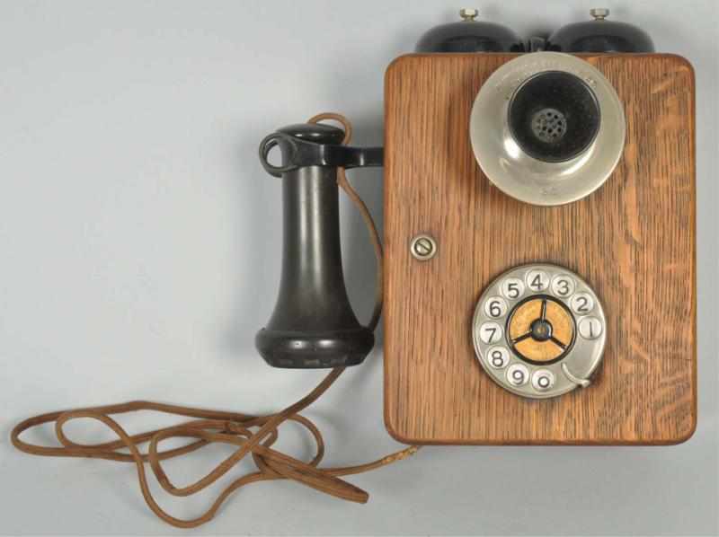 Appraisal: Automatic Electric Compact Wall Telephone Circa Oak Nickel marked faceplate