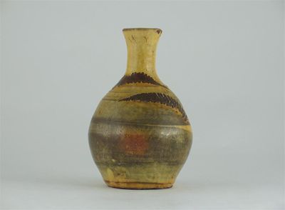 Appraisal: A Devon slipware bottle vase decorated with three stencilled fern