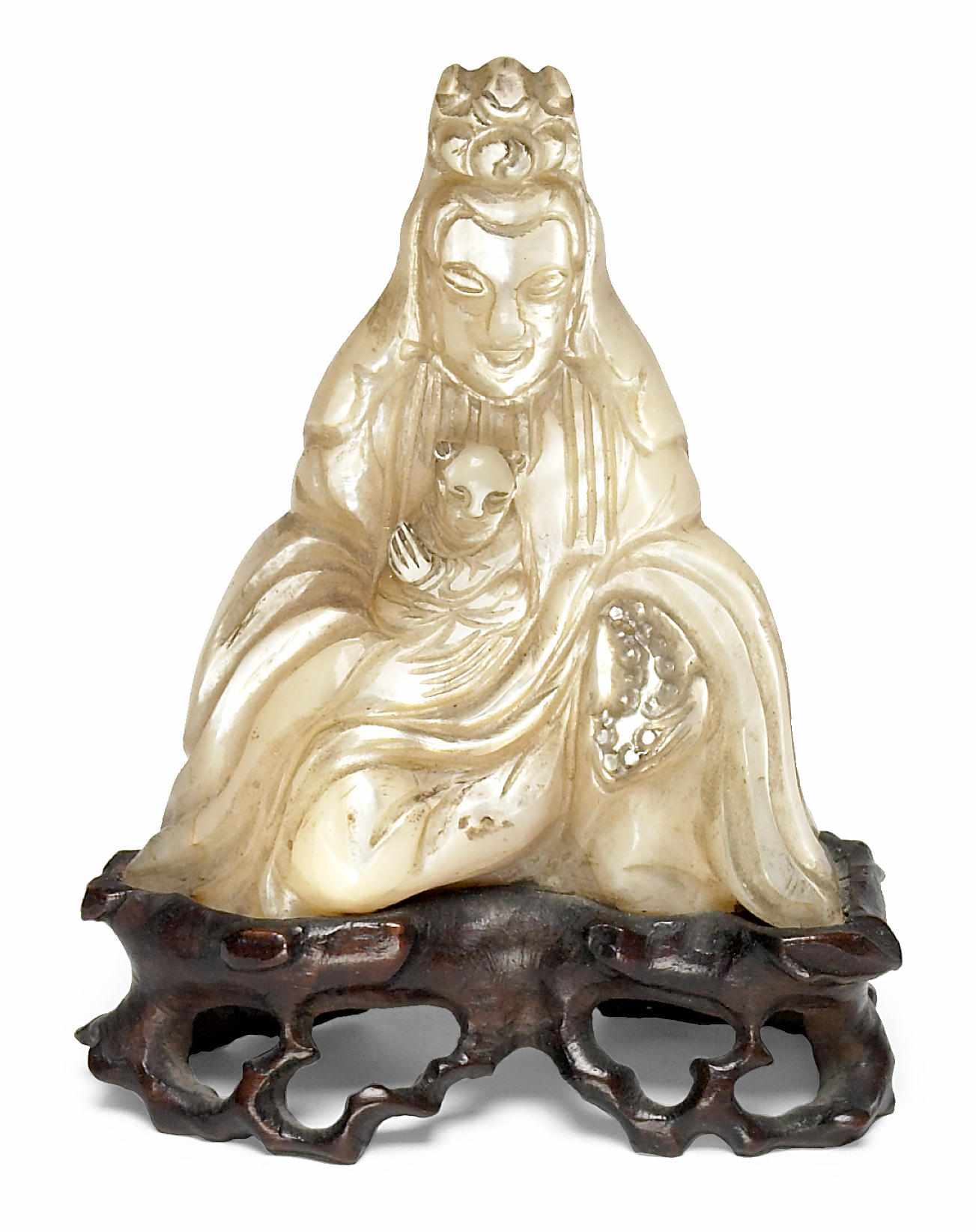 Appraisal: A small Chinese carved mother of pearl figure of Guanyin