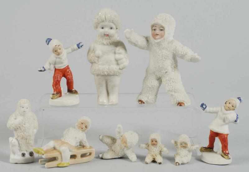 Appraisal: Lot of Bisque Snow Babies Description Large standing baby with