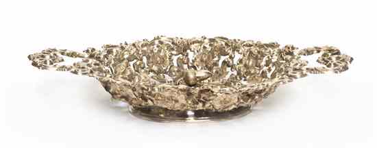 Appraisal: A Continental Silver Basket of oval handled form centered with