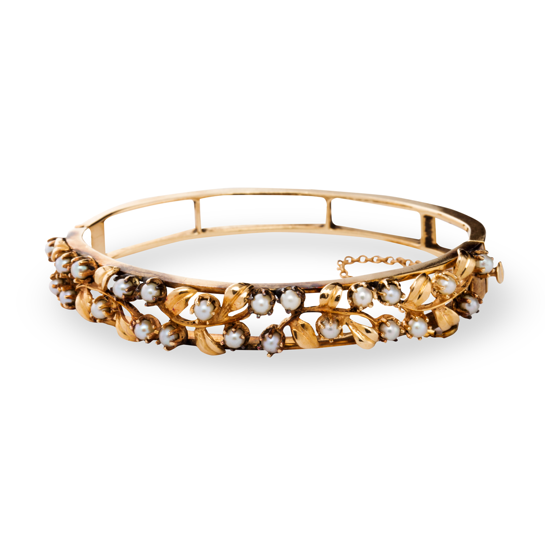 Appraisal: A SEED PEARL AND FOURTEEN KARAT GOLD BANGLE A seed