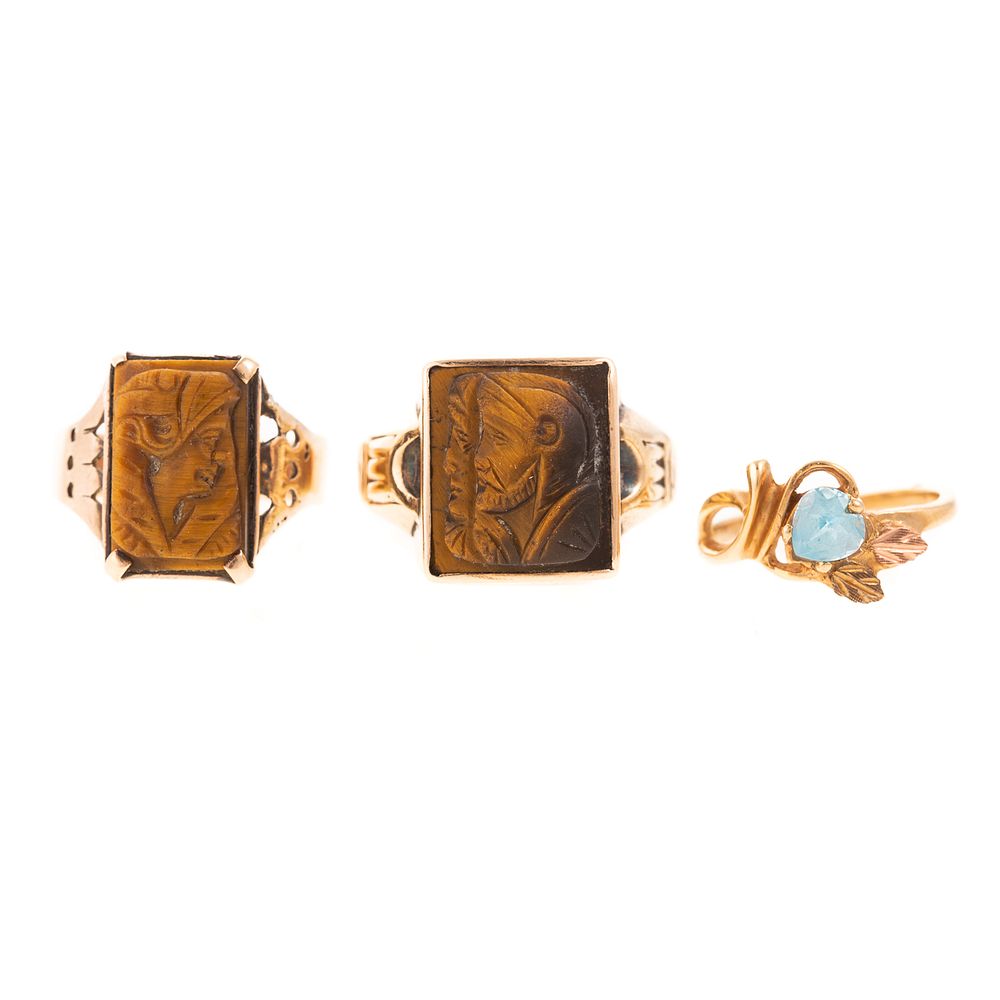 Appraisal: Two Tiger Eye Cameo Rings A Blue Topaz Ring c