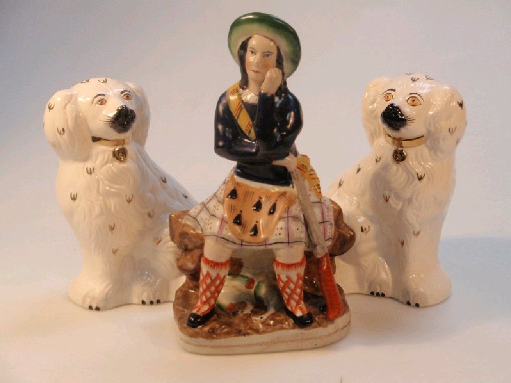 Appraisal: A pair of Royal Doulton pottery seated spaniels with black