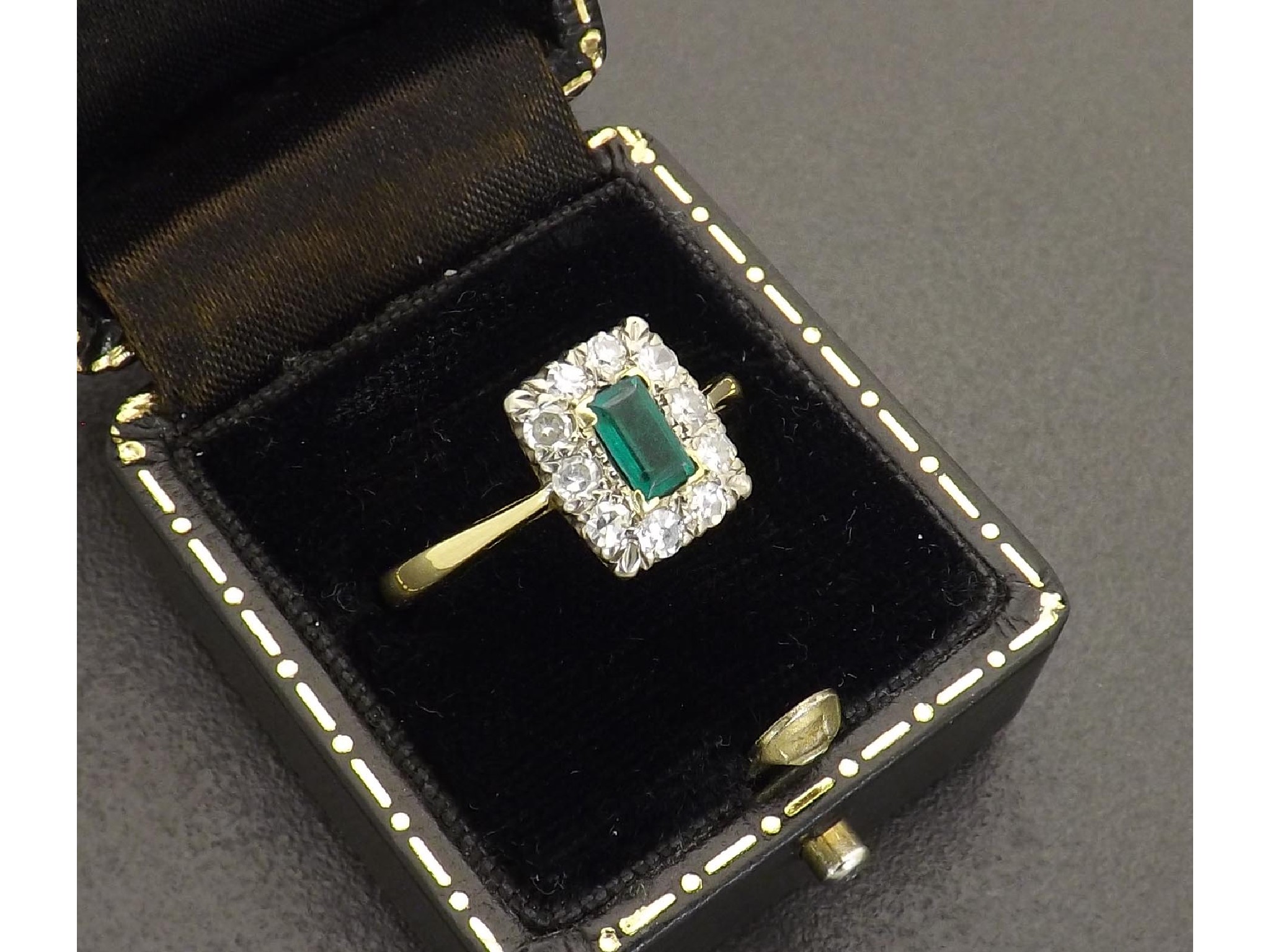 Appraisal: Attractive ct emerald and diamond rectangular cluster ring the centre