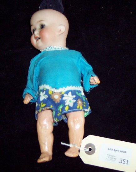 Appraisal: A small German doll the head with impressed mark Heubach