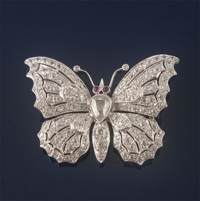 Appraisal: A diamond set butterfly brooch centred with a pear shaped