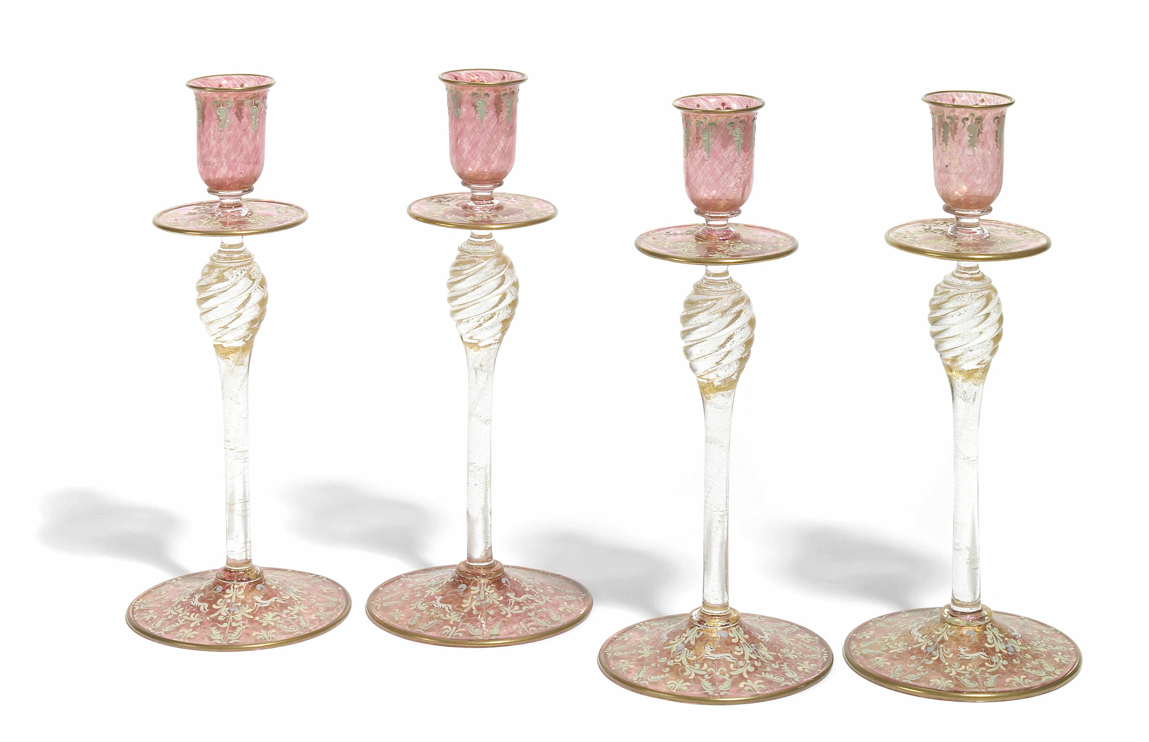 Appraisal: A set of four Venetian enamel decorated glass candlesticks height