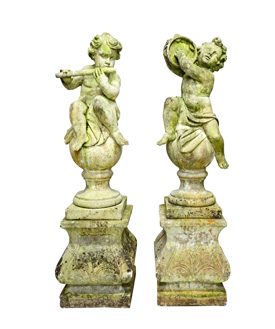 Appraisal: A set of four composition stone figures of cherubs playing