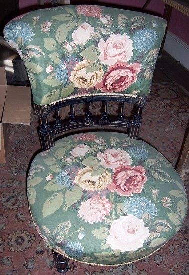 Appraisal: A Victorian ebonised nursing chair the upholstered back on a