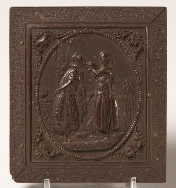 Appraisal: Allegorical figural gutta percha case with ambrotype portrait of a