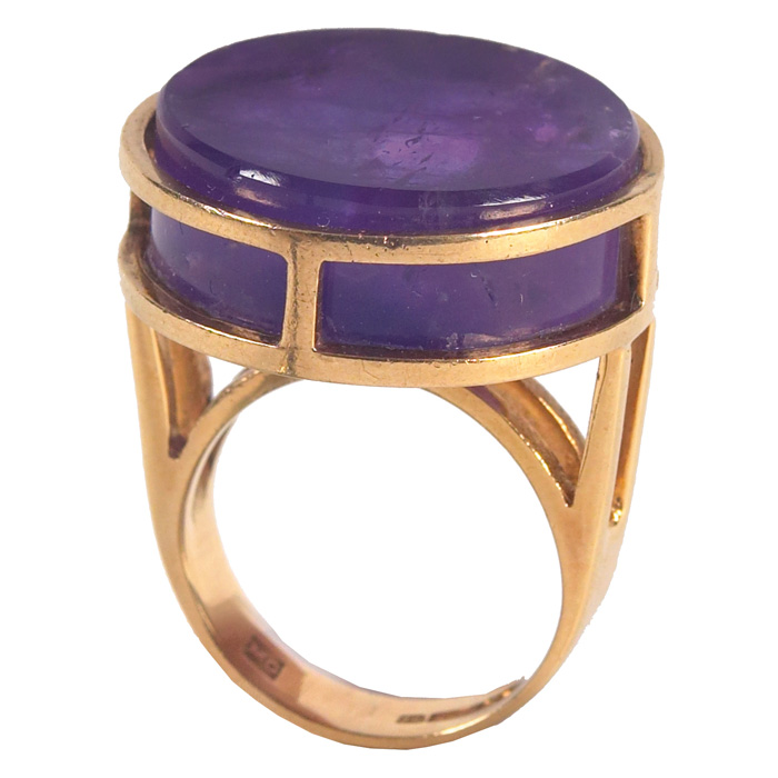 Appraisal: Gold and Amethyst ring round polished amethyst in a gold