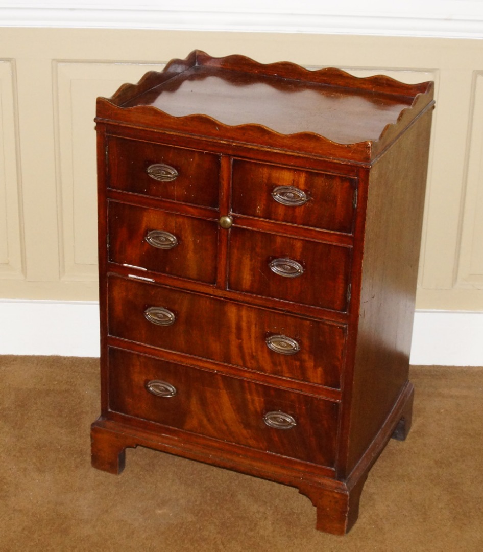 Appraisal: A George III mahogany night commode with a shaped gallery