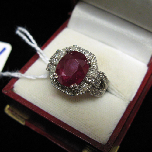 Appraisal: RUBY DIAMOND AND FOURTEEN KARAT WHITE GOLD DINNER RING WITH