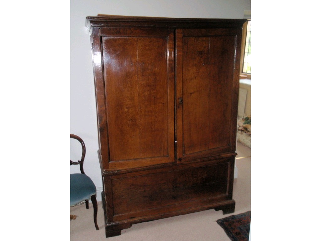 Appraisal: An thC and later oak cupboard converted to a wardrobe