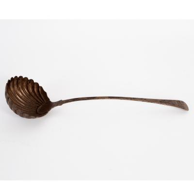 Appraisal: A George III feather-edge silver soup ladle W Tweedie London