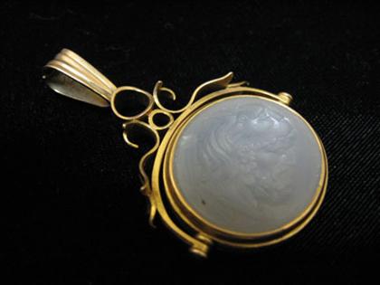 Appraisal: Yellow gold and intaglio carved moonstone swivel fob