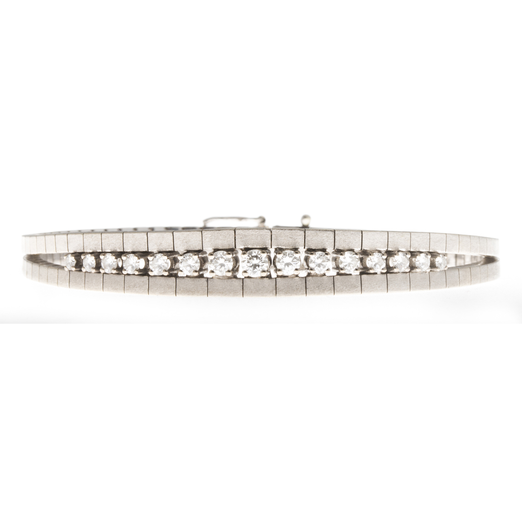 Appraisal: A diamond set bracelet composed of flexible brushed metal square