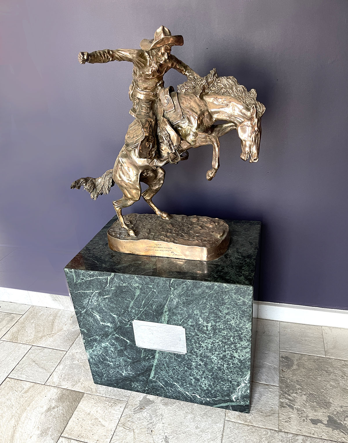 Appraisal: BRONCO BUSTER SILVER SCULPTURE AFTER FREDERIC REMINGTON Inscribed on the