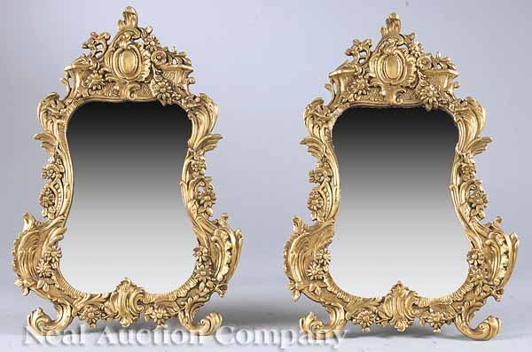 Appraisal: A Pair of Gilt Bronze Vanity Mirrors in the Rococo