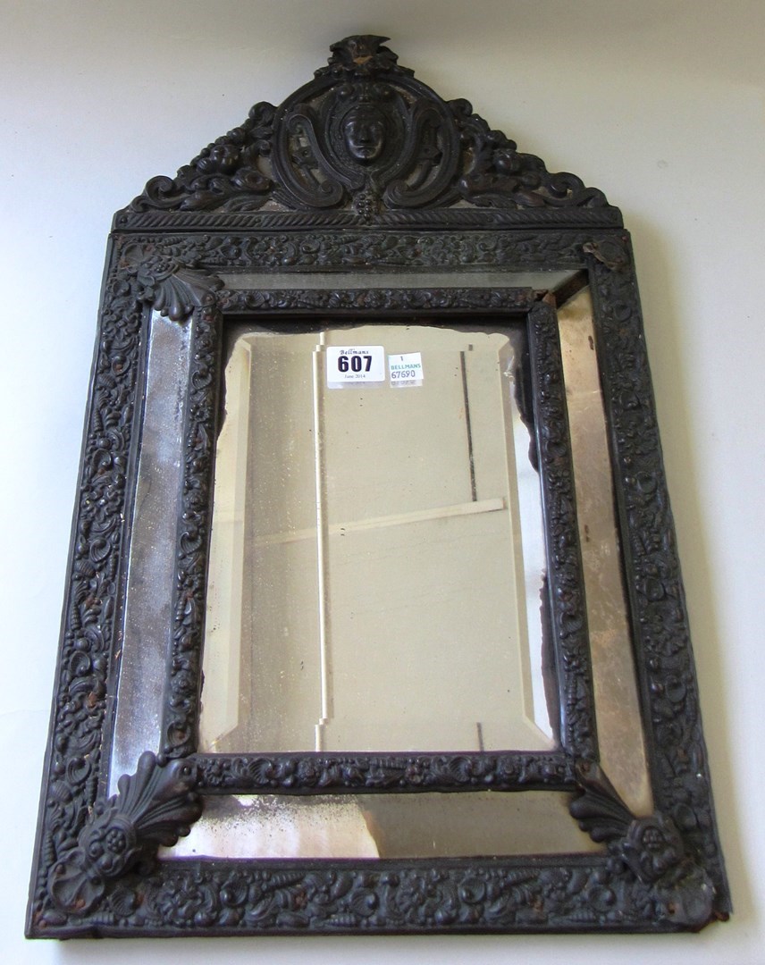 Appraisal: A th century embossed brass marginal wall mirror with bevelled