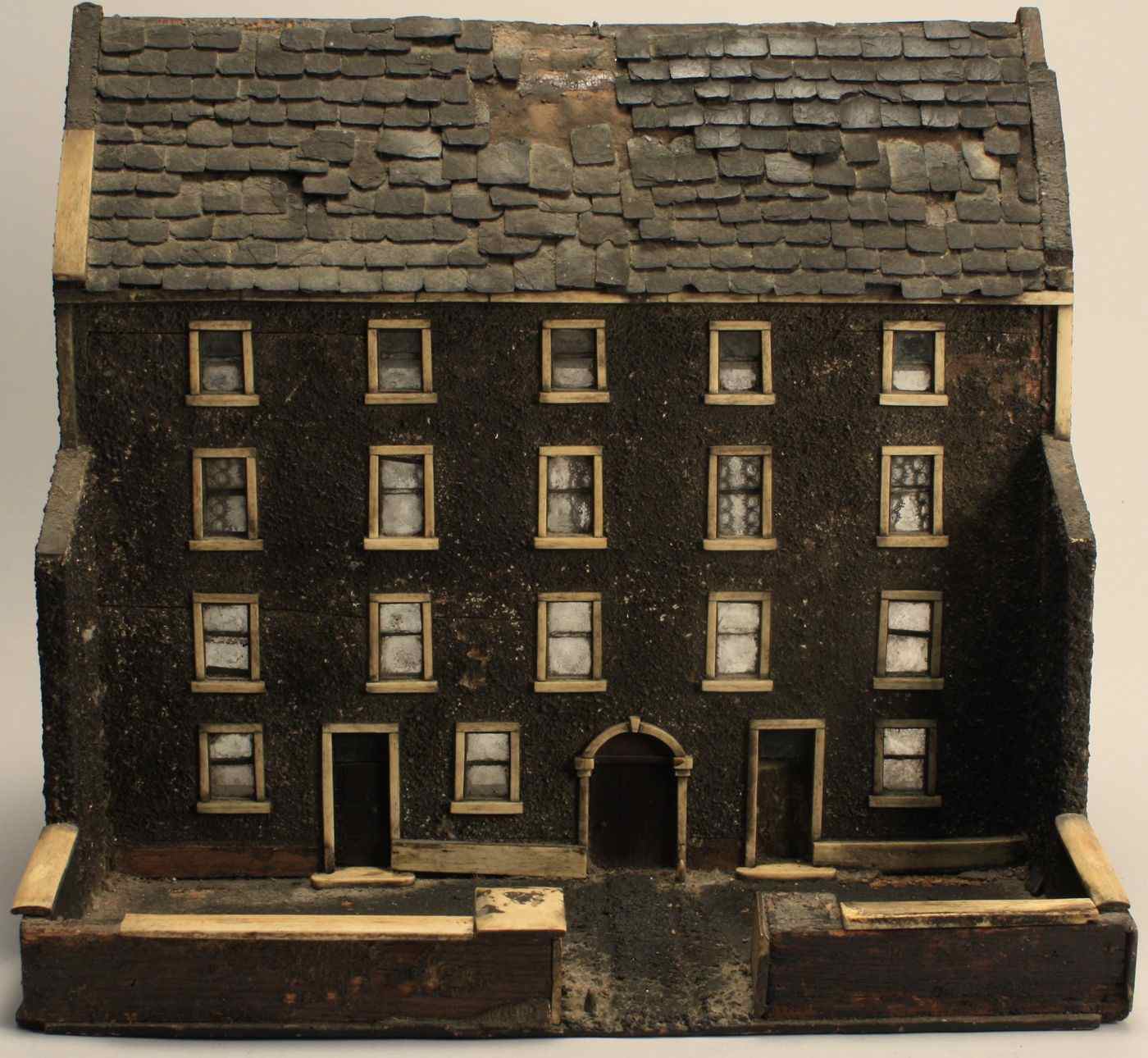 Appraisal: ANTIQUE DOLLHOUSEIn wood slate and bone with sandpaper finish Eighteen