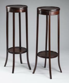 Appraisal: Edwardian two Pair of Edwardian two-tiered mahogany plant stands the