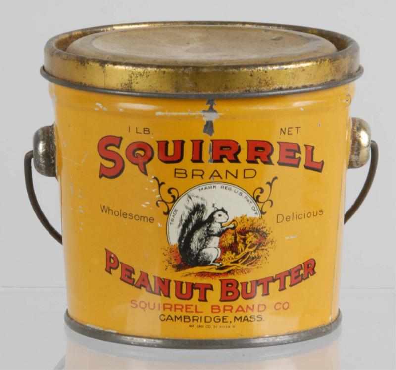 Appraisal: Squirrel lb Peanut Butter Pail Description Orange variation A couple