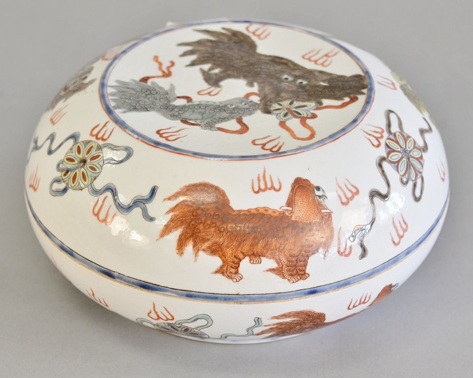 Appraisal: Chinese porcelain covered dish having painted foo dog decoration and