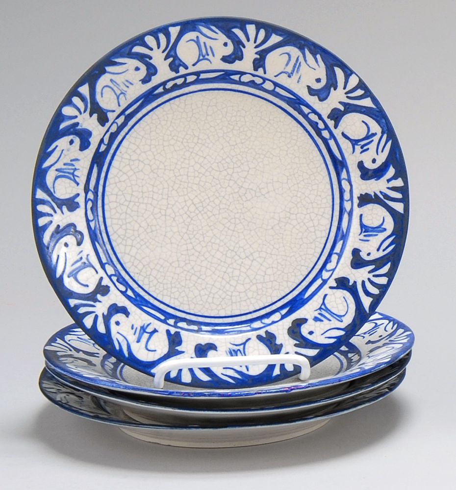 Appraisal: FOUR DEDHAM POTTERY PLATES In Rabbit pattern Two with blue