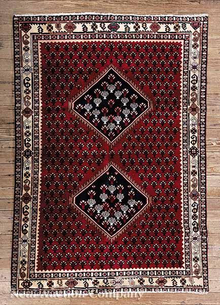 Appraisal: A Persian Afshar Carpet crimson ground central medallions overall repeating