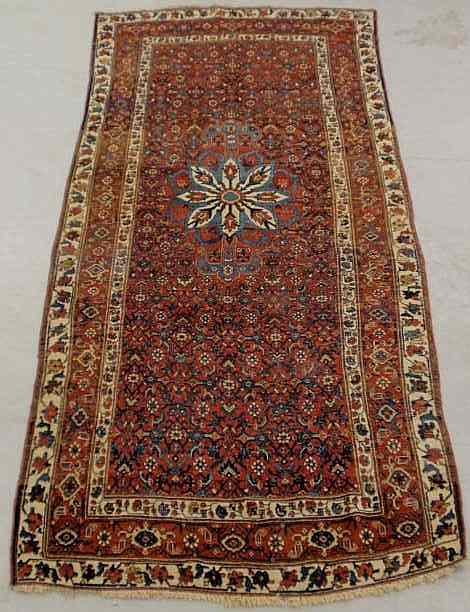 Appraisal: Colorful Persian oriental center hall carpet ivory border red field