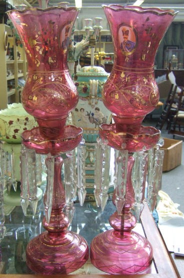 Appraisal: A pair of cranberry glass lustre vases th century with