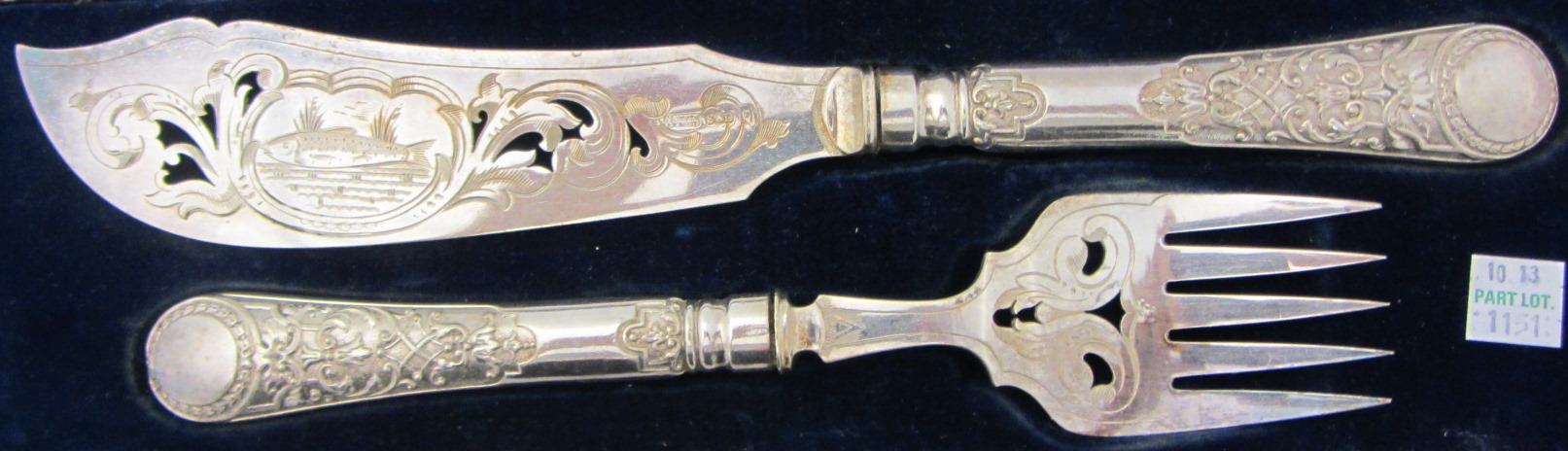 Appraisal: A pair of plated fish servers with pierced and engraved