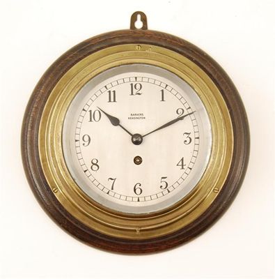 Appraisal: A brass cased bulkhead type clock with a replaced platform