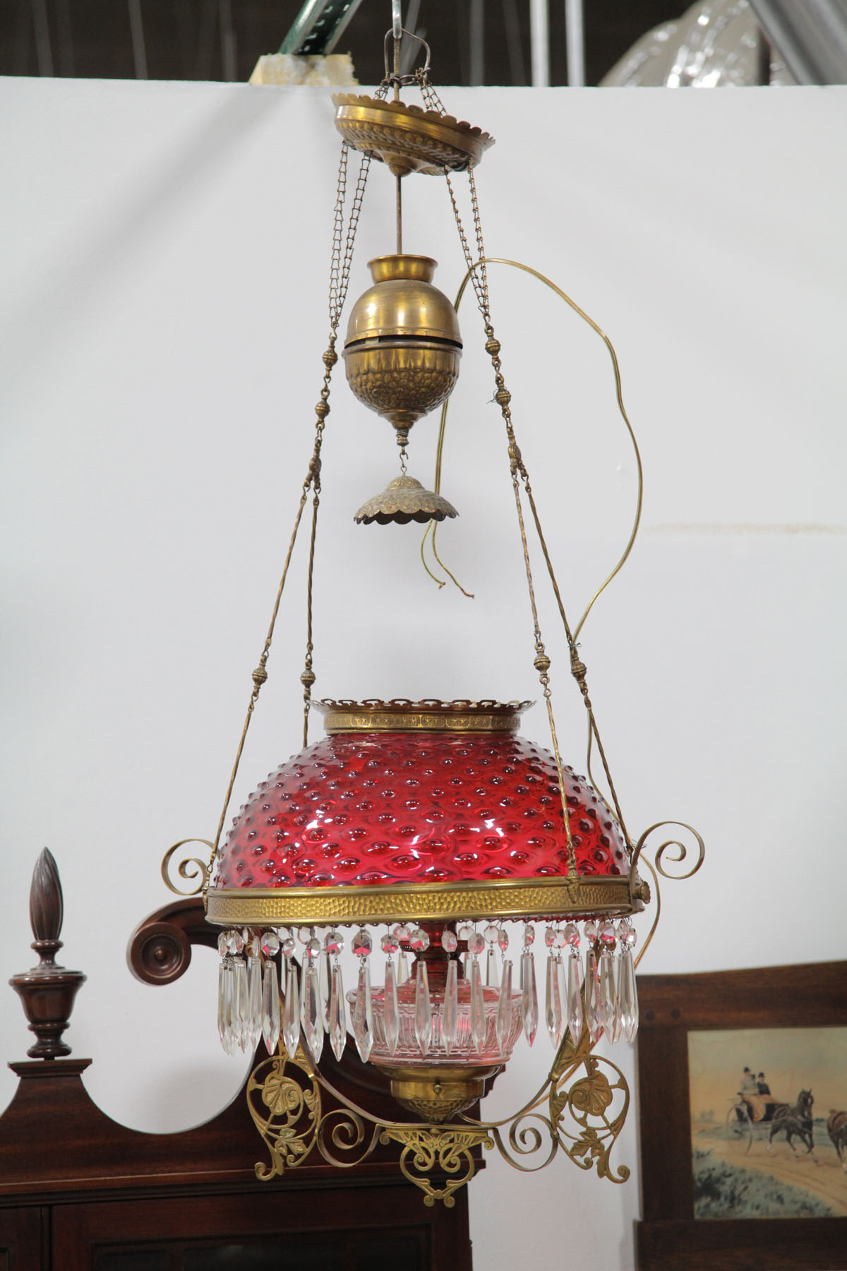 Appraisal: HANGING HALL LIGHT American late th century Brass frame cranberry