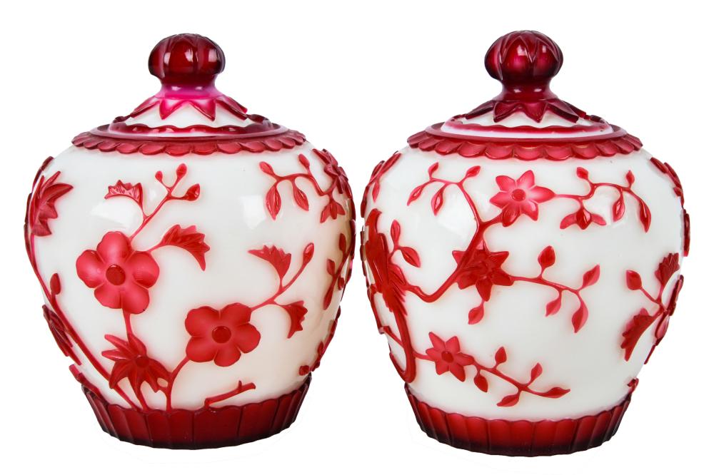 Appraisal: PAIR OF CHINESE PEKING GLASS COVERED JARSred on white ground