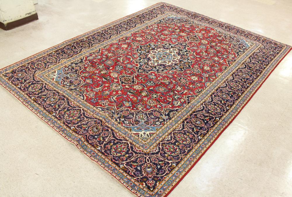 Appraisal: HAND KNOTTED PERSIAN CARPET floral and central floral medallion design