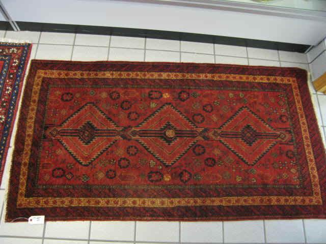 Appraisal: Belouchi Persian Handmade Rug stylized floral geometric designs on deep