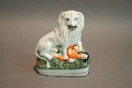 Appraisal: A Staffordshire figure of British lion and Napolean