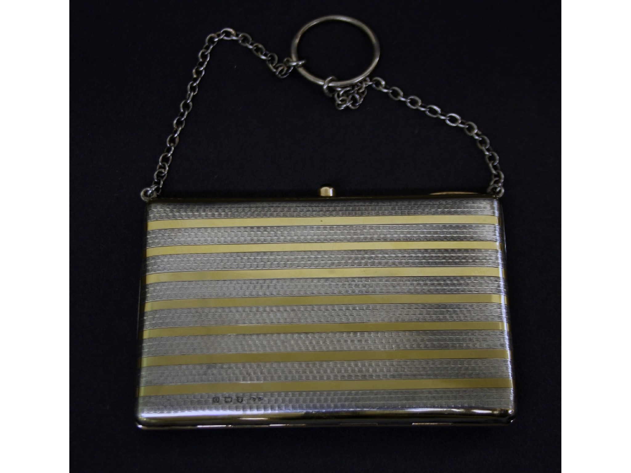 Appraisal: Attractive early th century silver-gilt purse on chain with striped