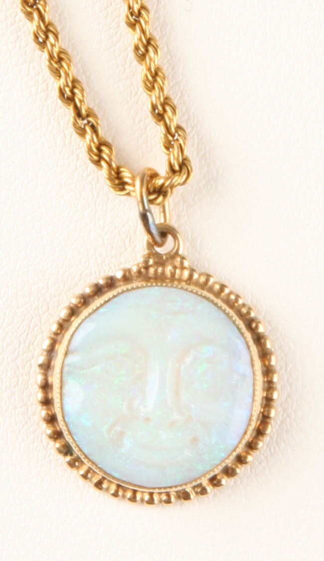 Appraisal: Opal pendant with face motif long chain K S