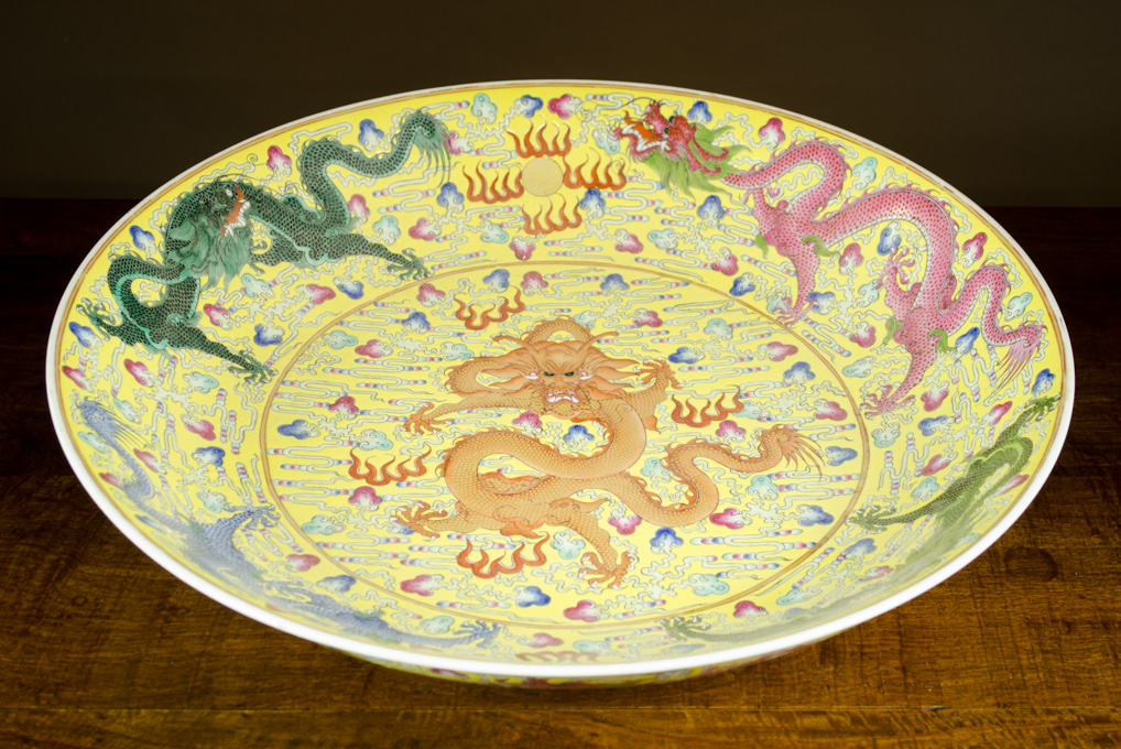 Appraisal: CHINESE QING FAMILLE ROSE PORCELAIN CHARGER hand painted dragons chasing