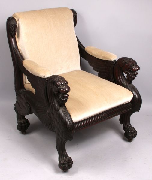 Appraisal: Heavily carved and upholstered Chinese chair with tiger head arms