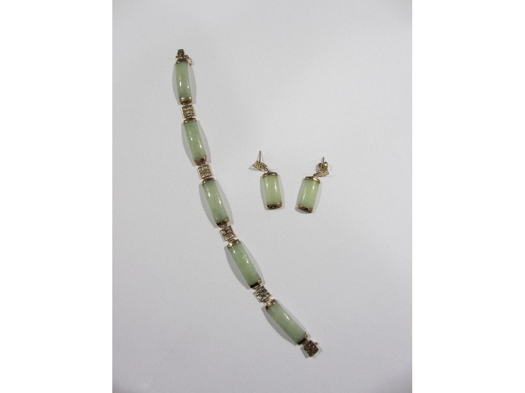 Appraisal: Nine carat gold mounted Chinese jade bracelet with matching earrings