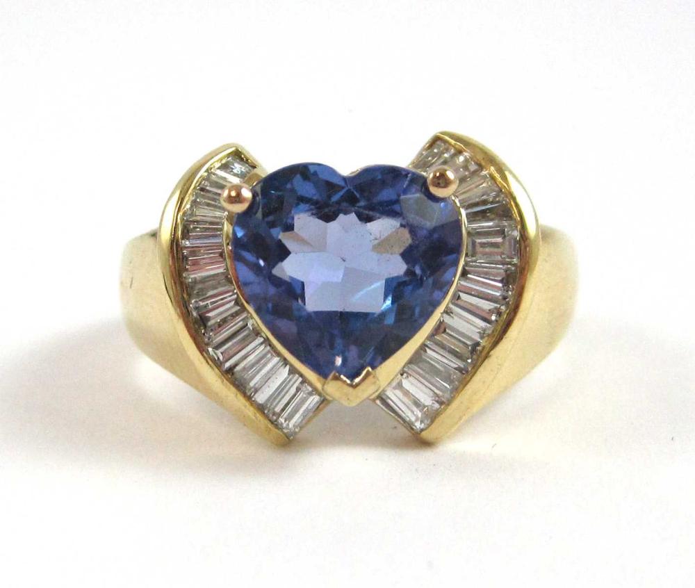 Appraisal: TANZANITE DIAMOND AND EIGHTEEN KARAT GOLD RING with a curved