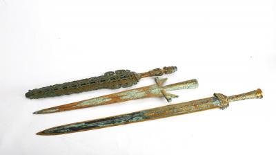 Appraisal: Three Chinese bronze swords and one scabbard