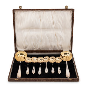 Appraisal: A Cased Set of Parcel Gilt SIlver-Plate Serving Spoons th